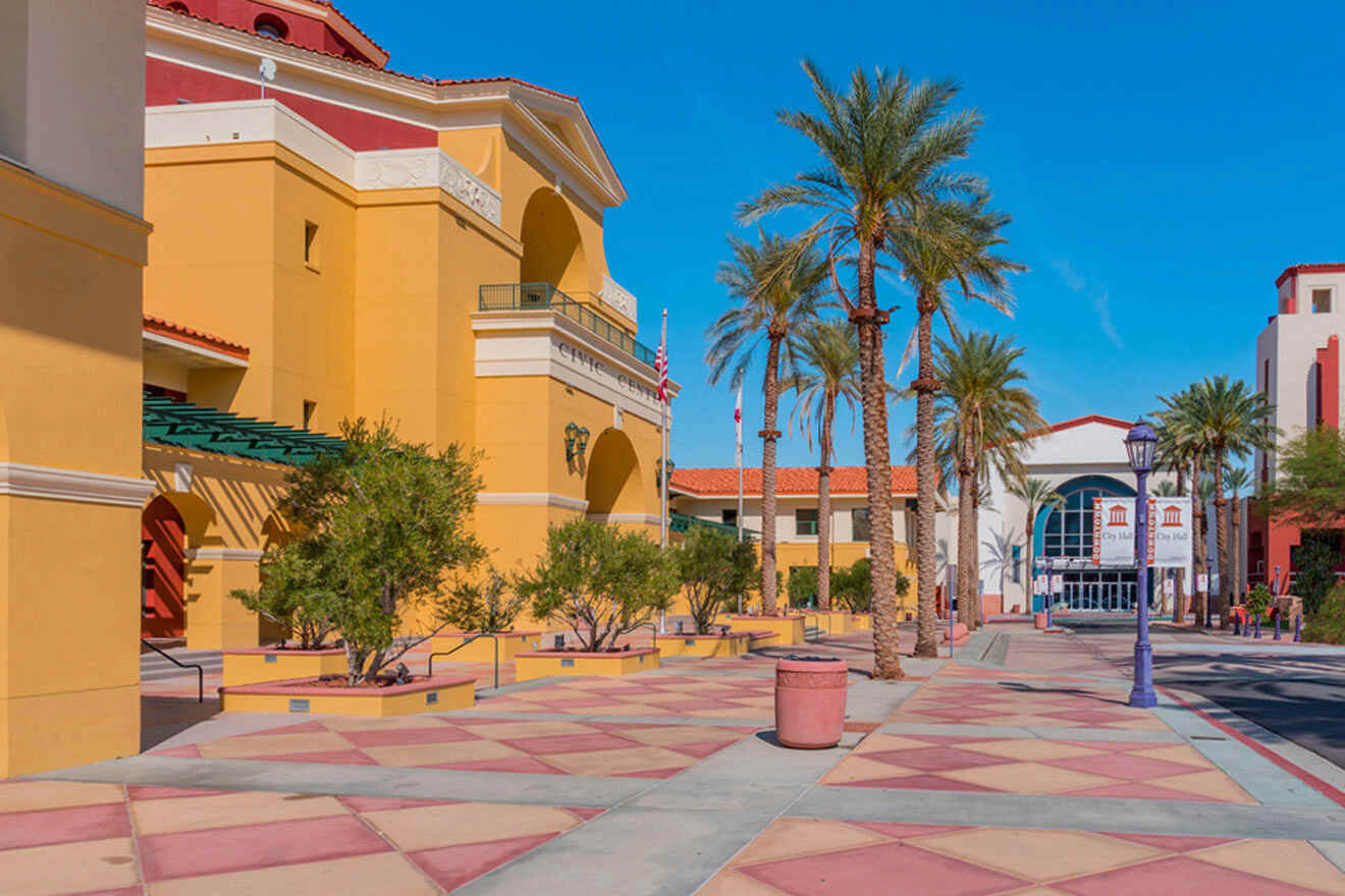 a street lined with palm trees and buildings