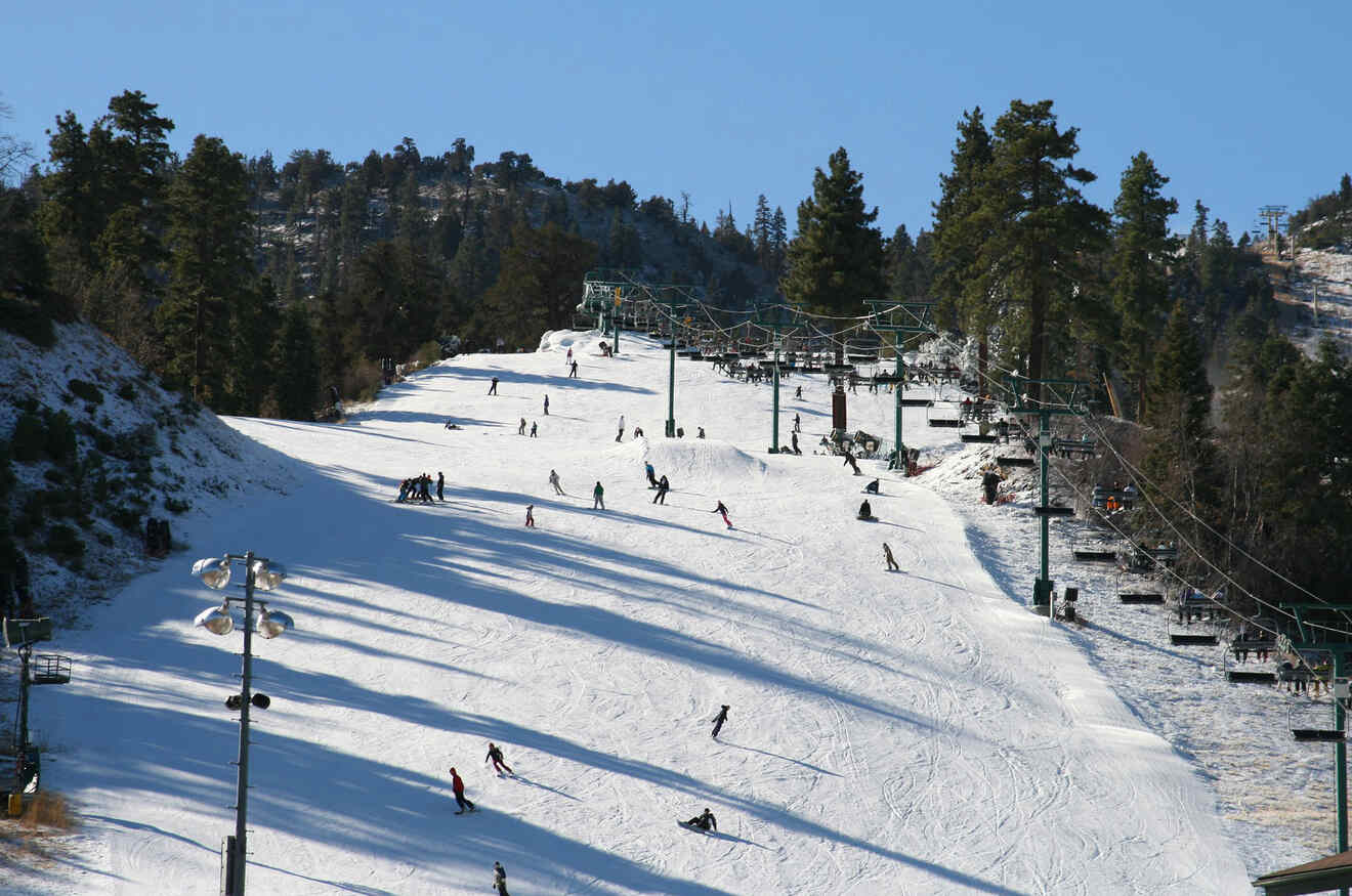 View of people skiing on slopes