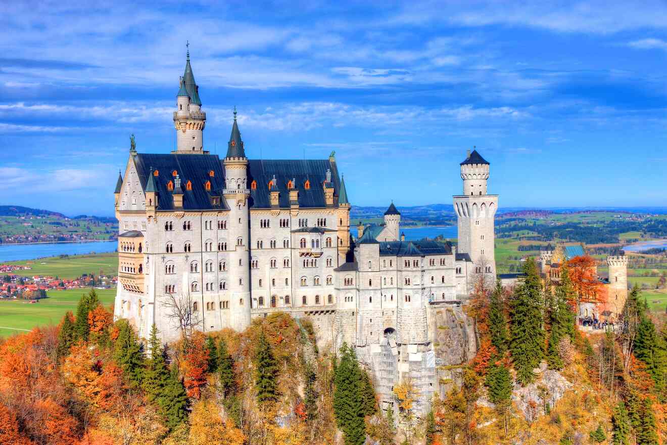 a large castle with towers on top of a hill