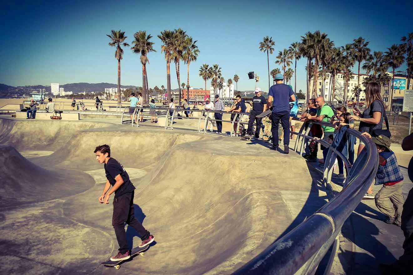 a young man riding a skateboard up the side of a ramp