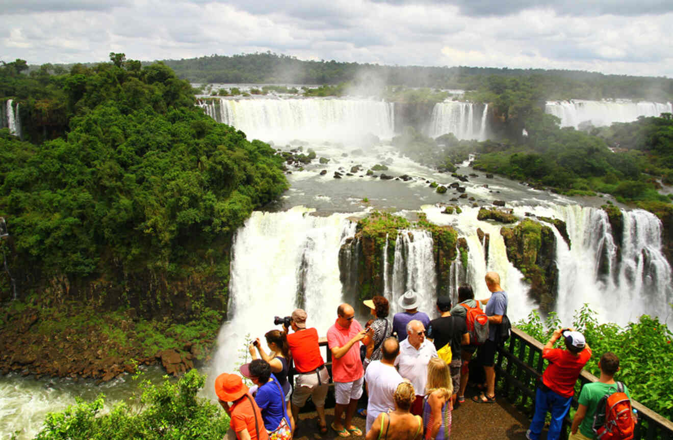 Visitors are at one of the view terraces of Iguazu Falls