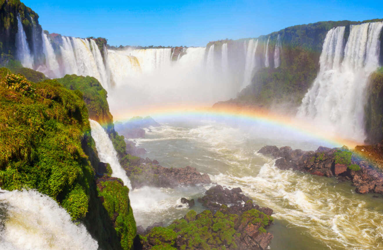 a rainbow over a waterfall