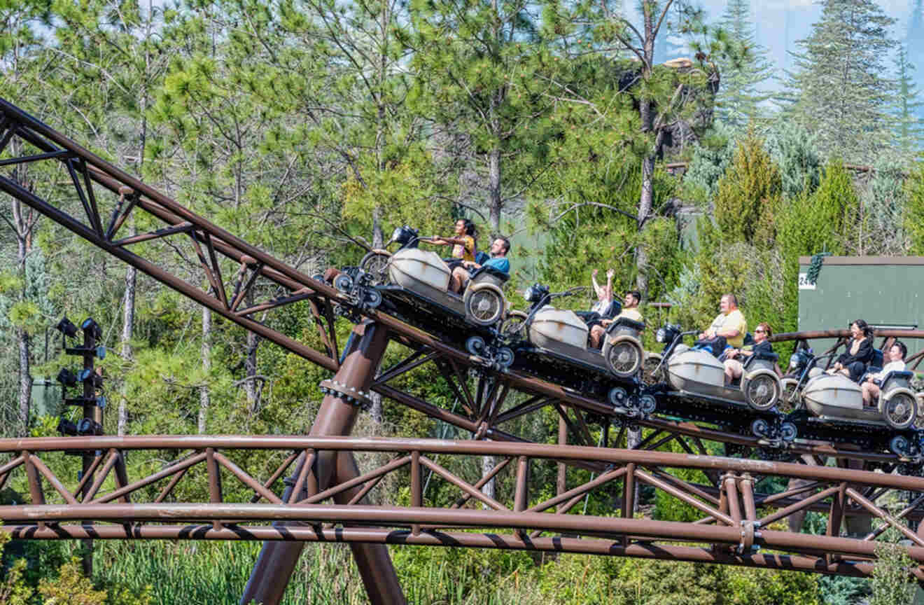 Adults and children riding on Hagrid's Motorbike Adventure
