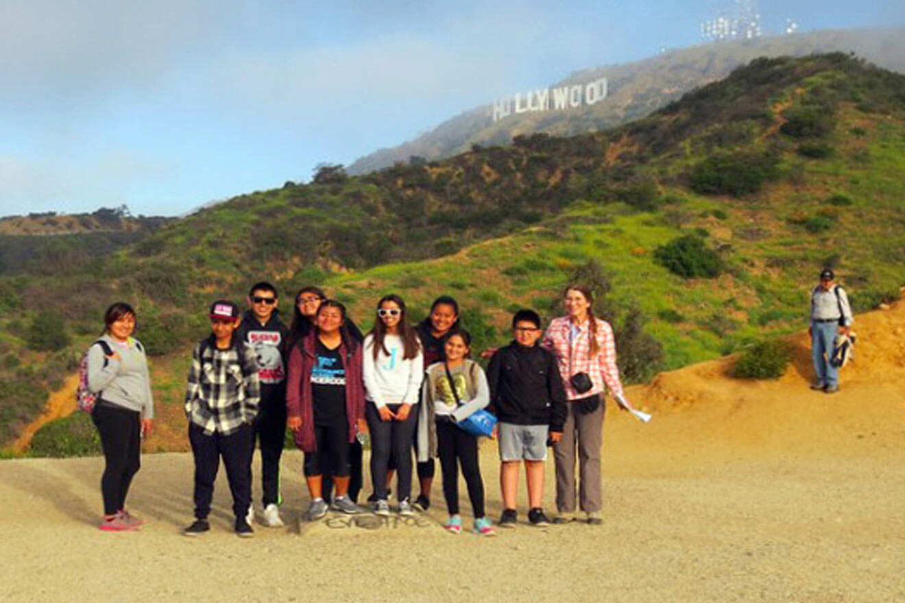 group of people at Hollywood sign hiking