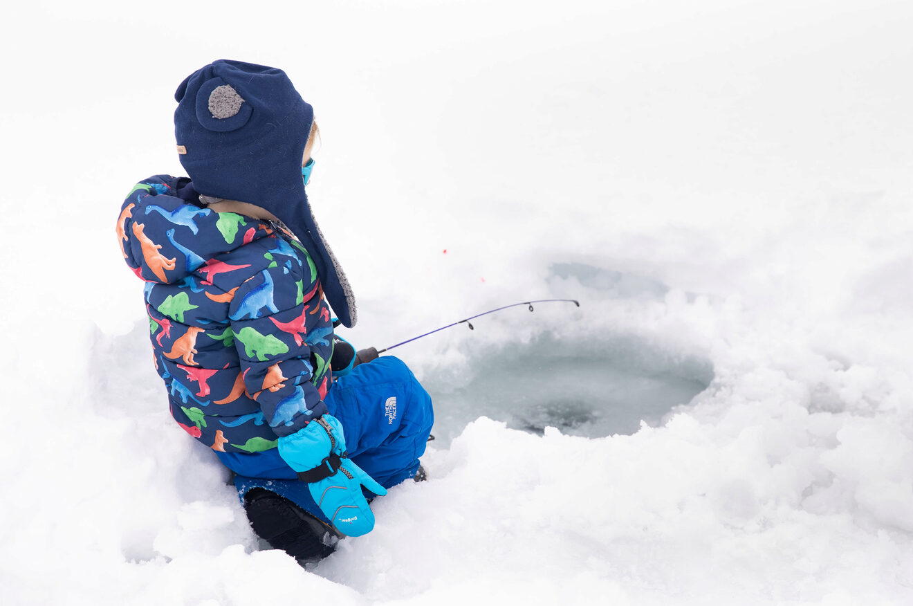 A child ice fishing