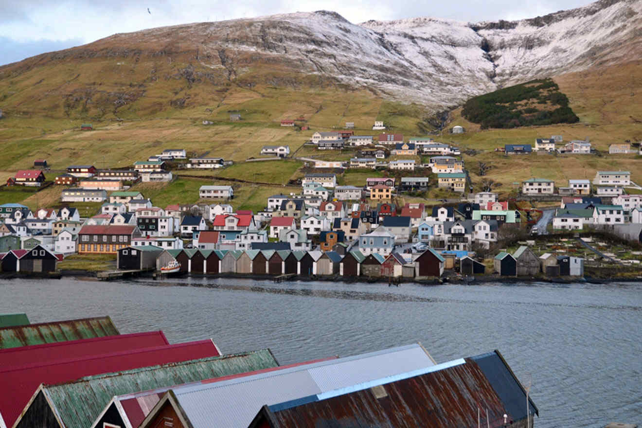 group of colorful houses sitting on the shore