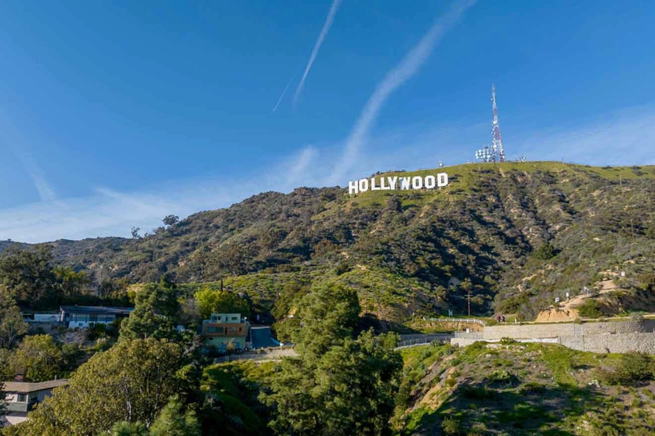 the Hollywood sign is on top of a hill