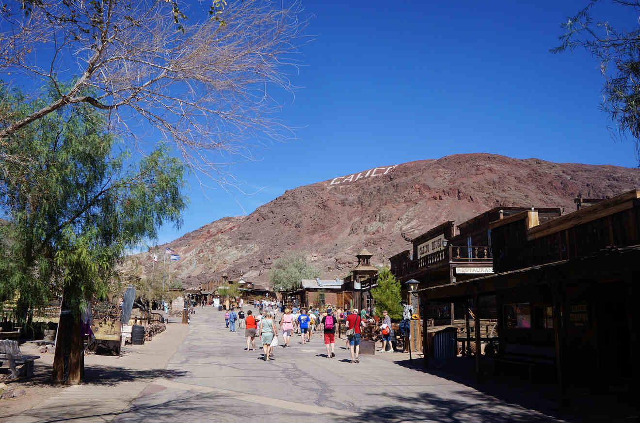 People walking in the street around Calico Ghost Town