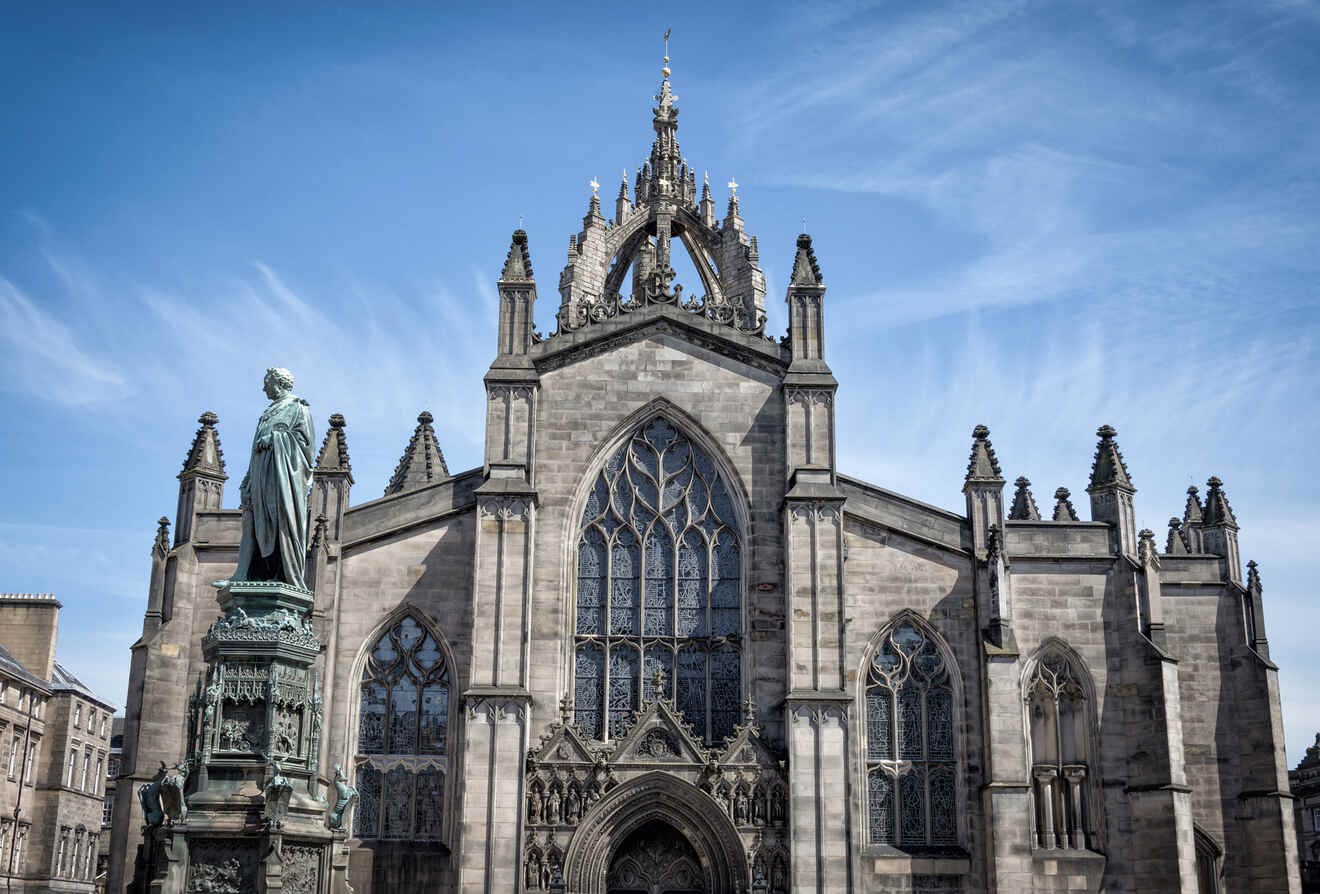 a large cathedral with a statue in front of it