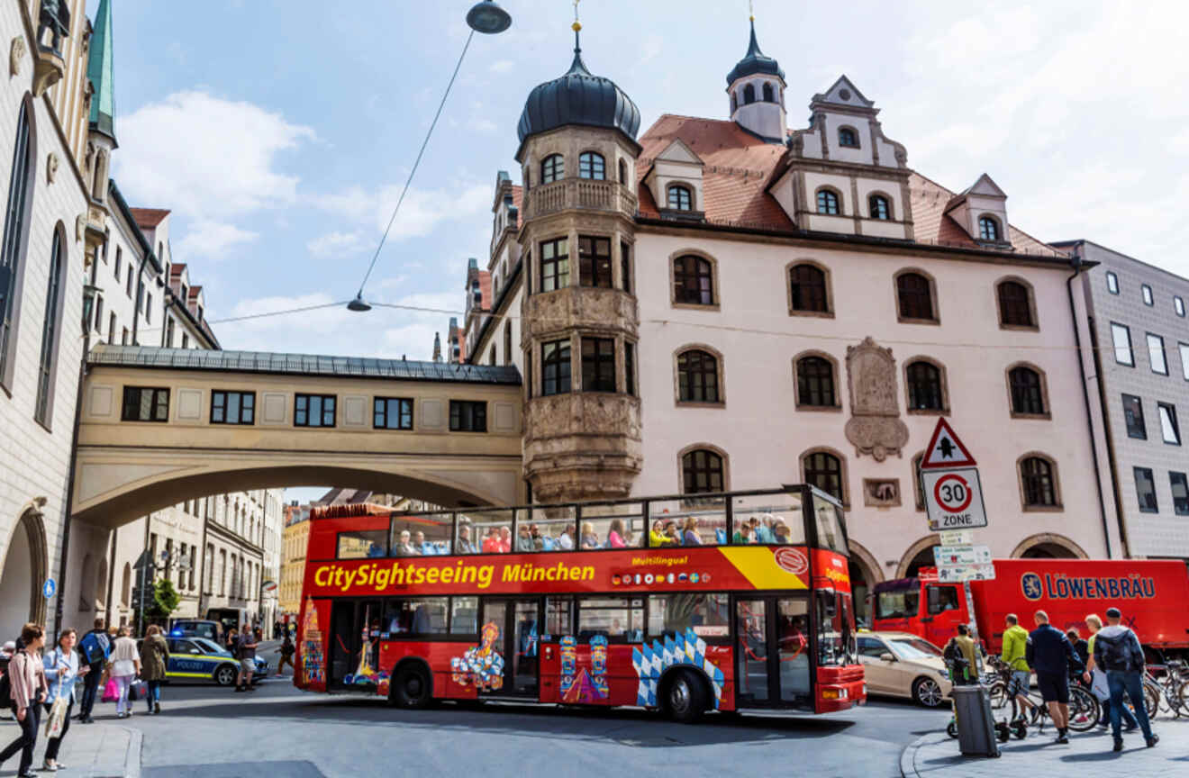 A double decker bus driving around Munich