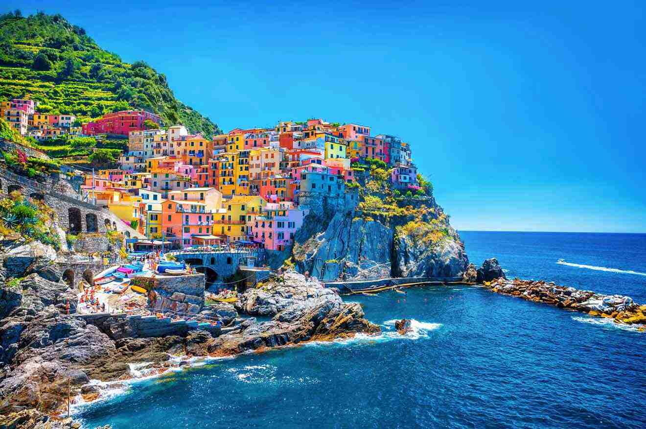 colorful houses on a cliff overlooking the ocean