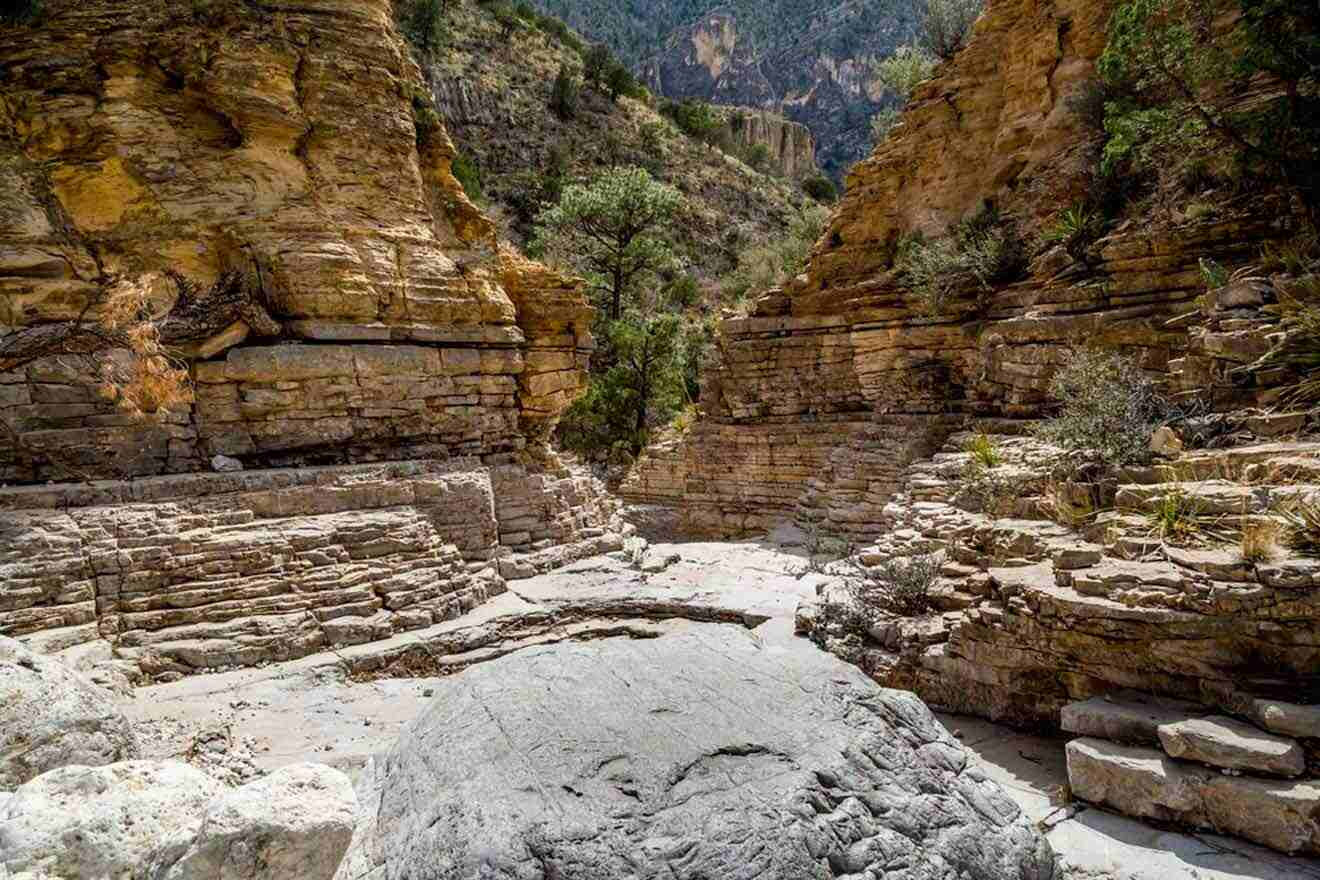 a large rock in the middle of a canyon