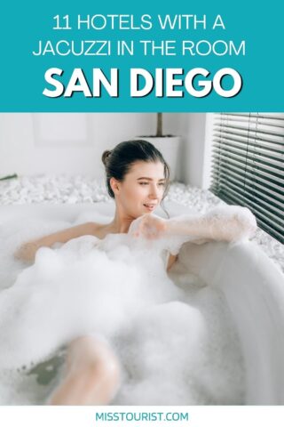 woman sitting in a foamy bathtub