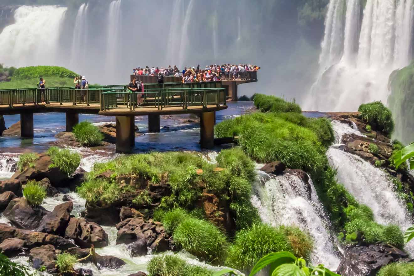 People on an observation deck looking at a waterfall