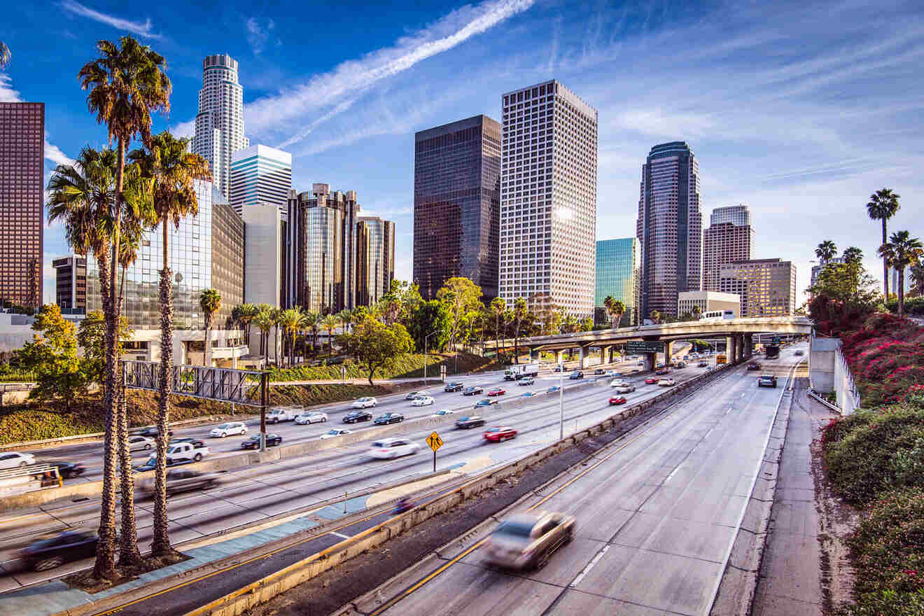 a freeway with a bunch of cars driving on it