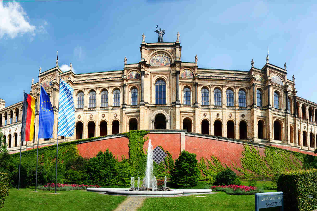 a large building with a fountain in front of it