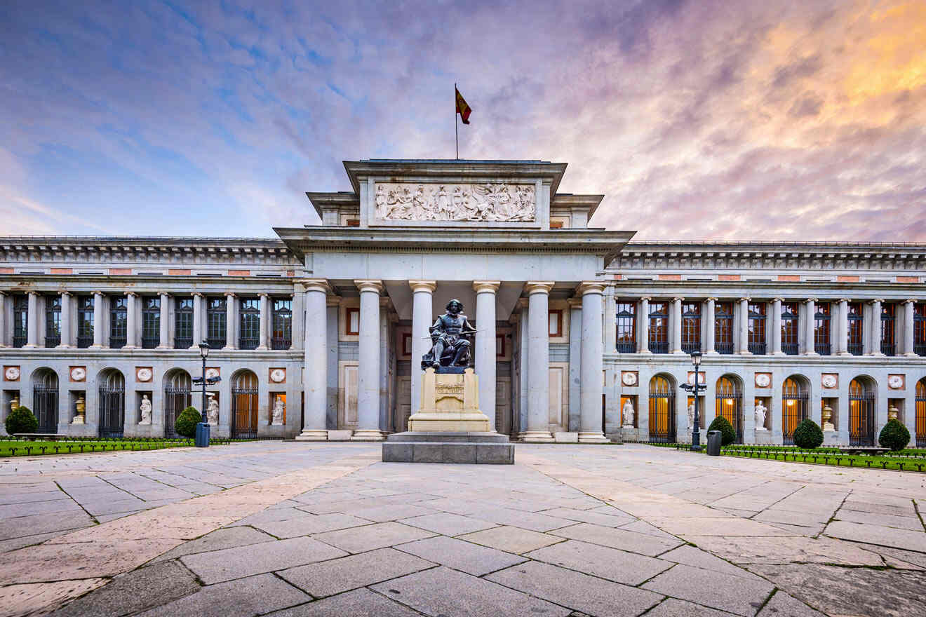 A building with columns and a statue in front of it.