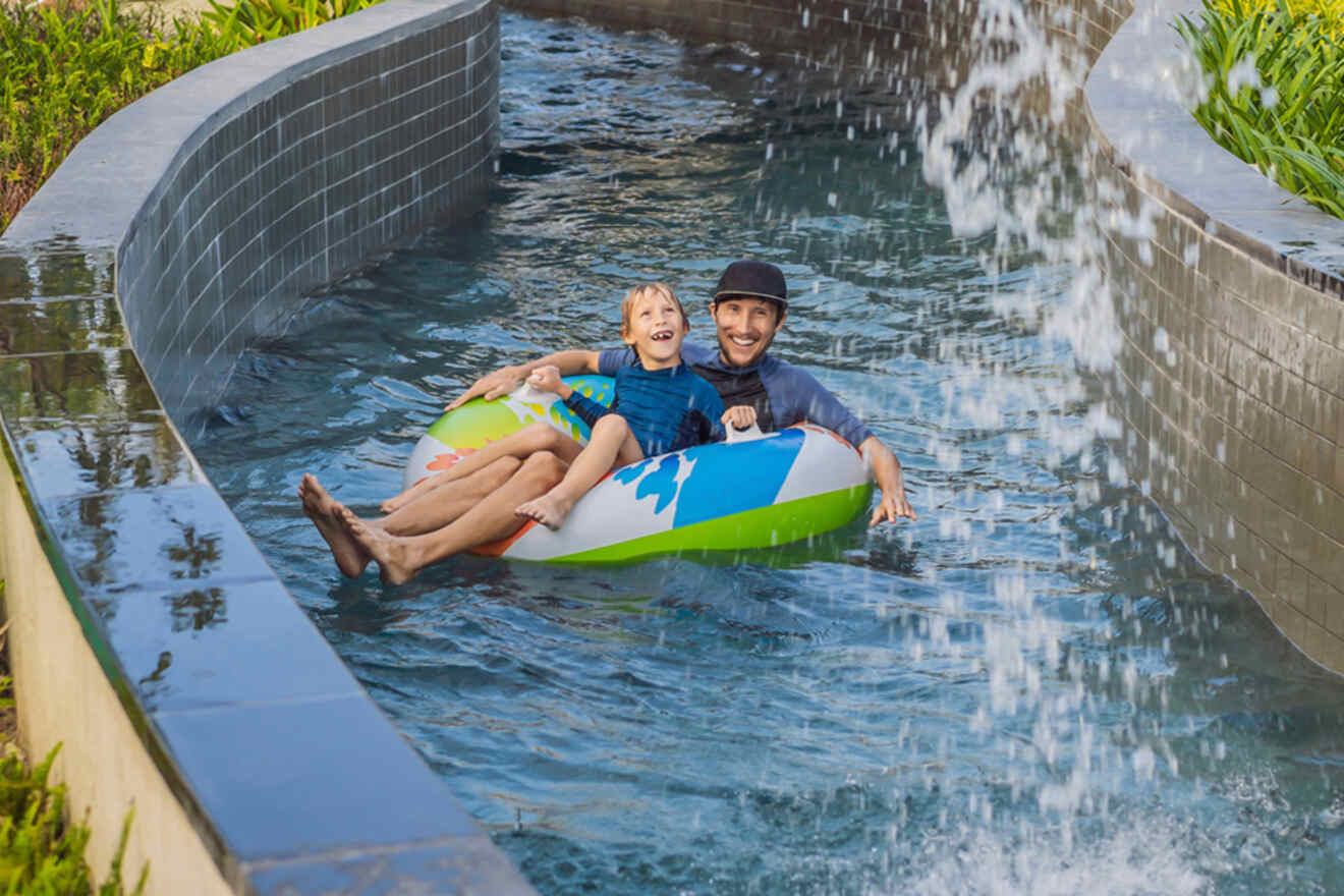 father and son on a tube in a lazy river