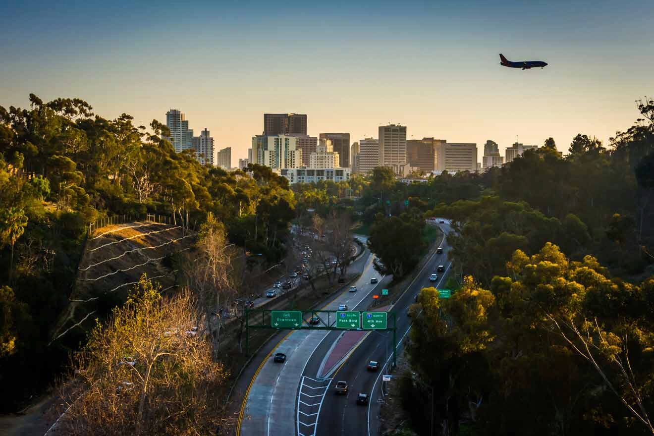 San Diego view at sunset with an airplane flying over the city