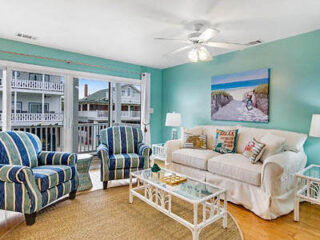 living room with couch and armchairs