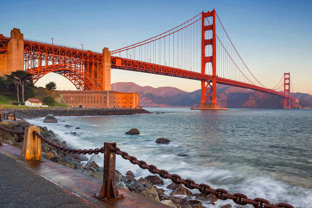 a large red bridge over a body of water