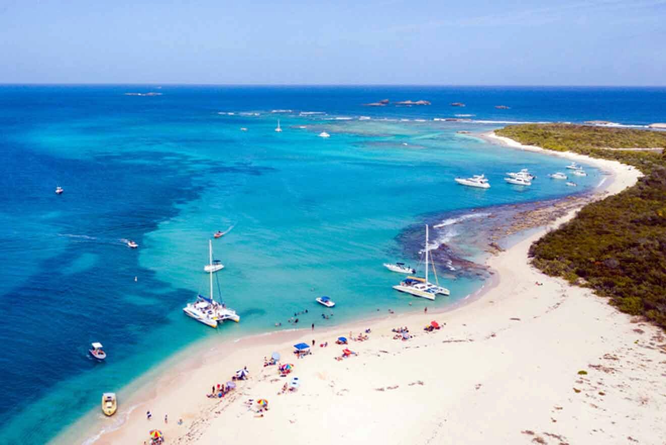 a group of boats floating on top of a blue ocean