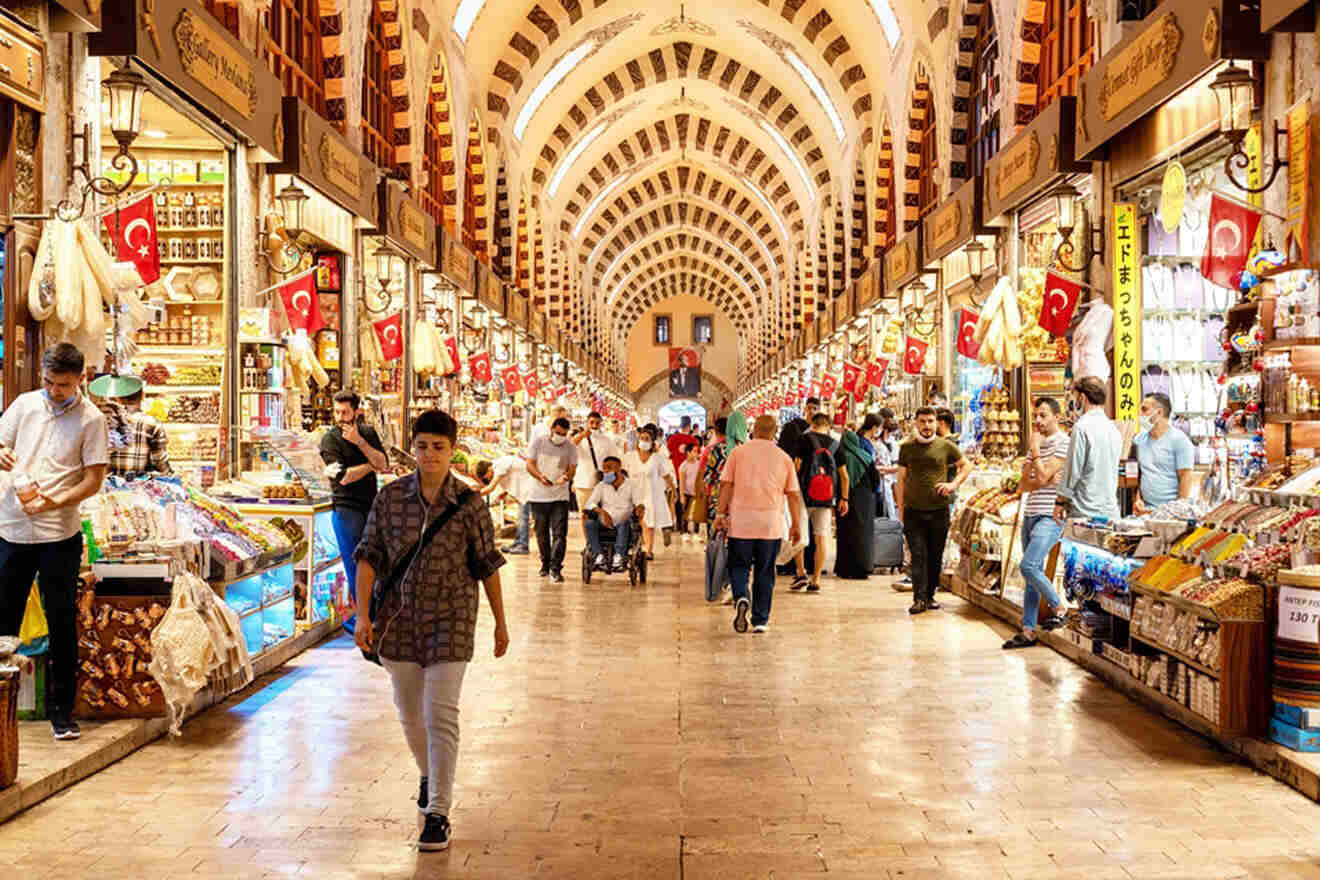 a group of people walking through a market