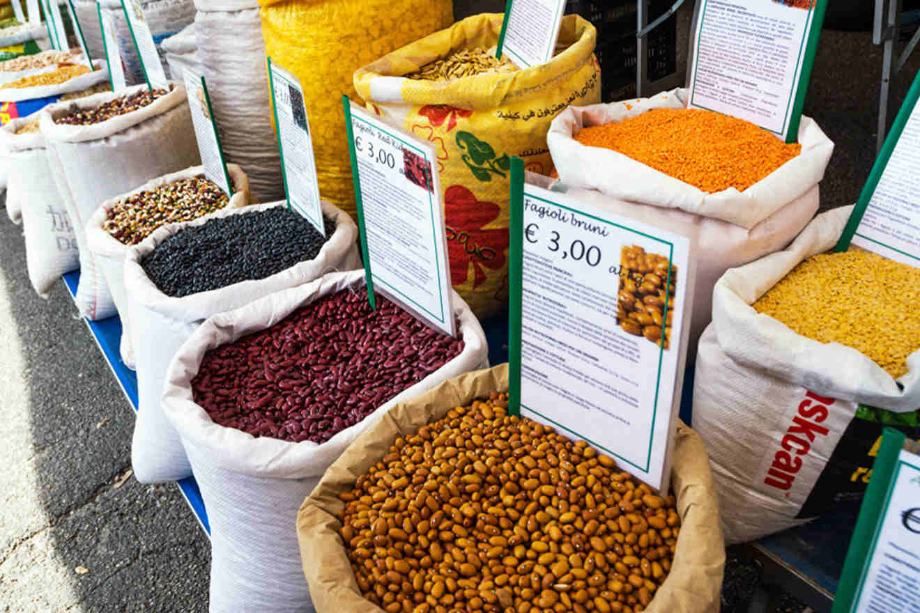 several bags of different types of food at a food market