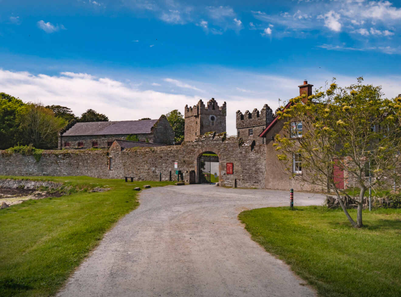 a stone building with a gate in front of it