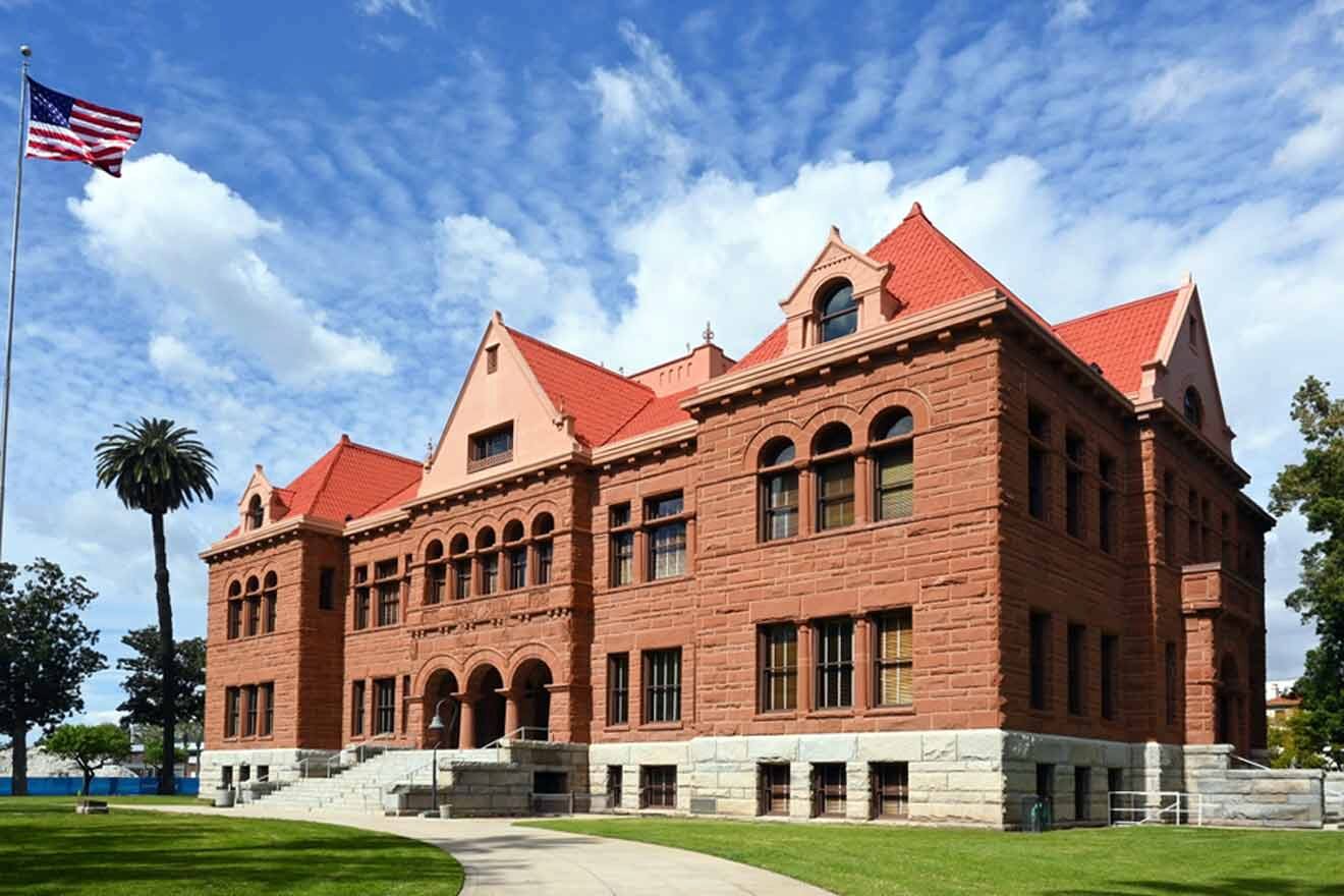 a large red brick building with a flag on top of it