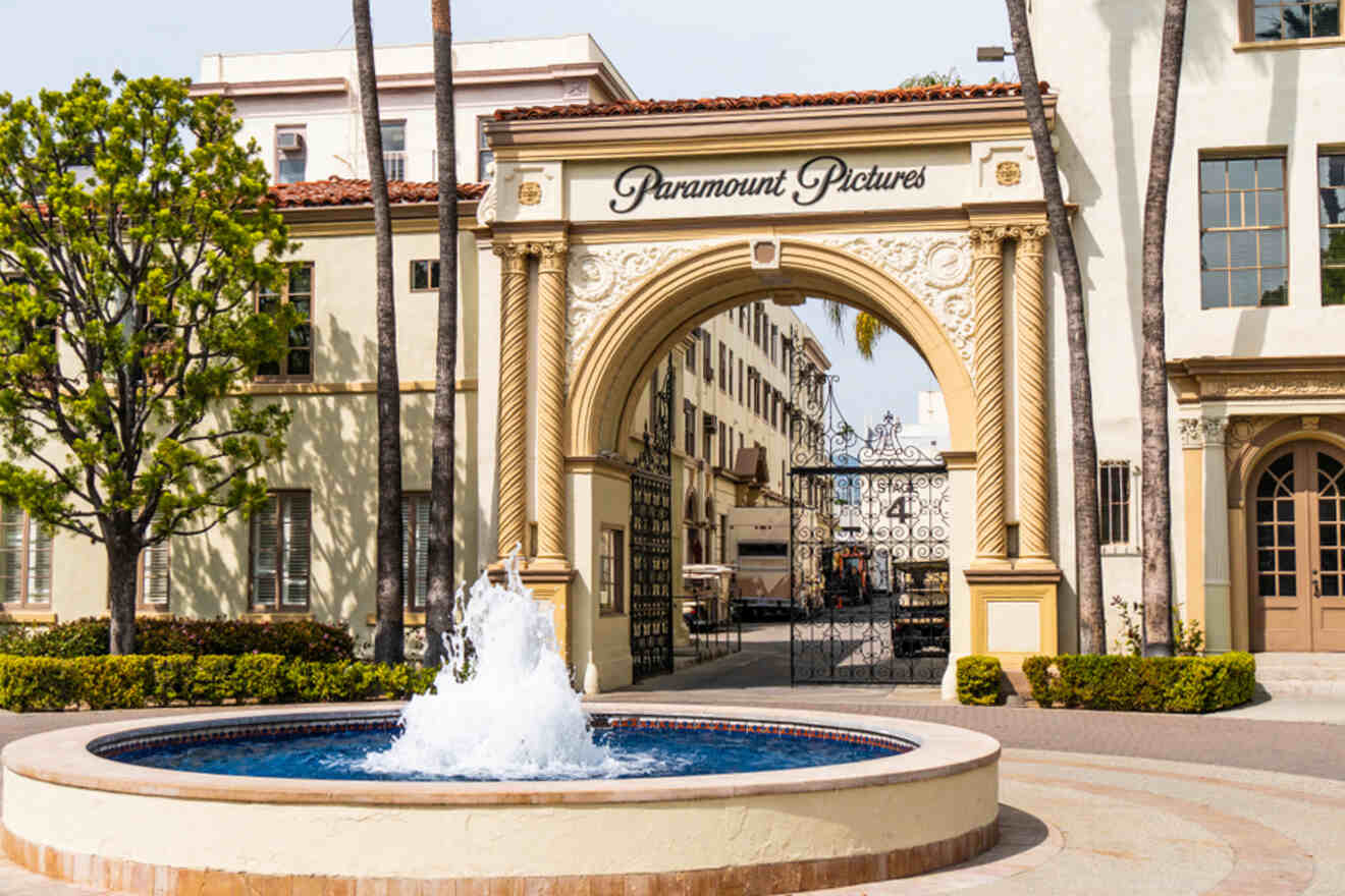 a large building with a fountain in front of it