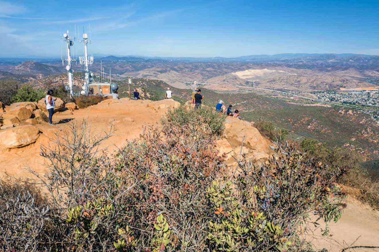 hikers on top of the cowles mountain enjoying the view