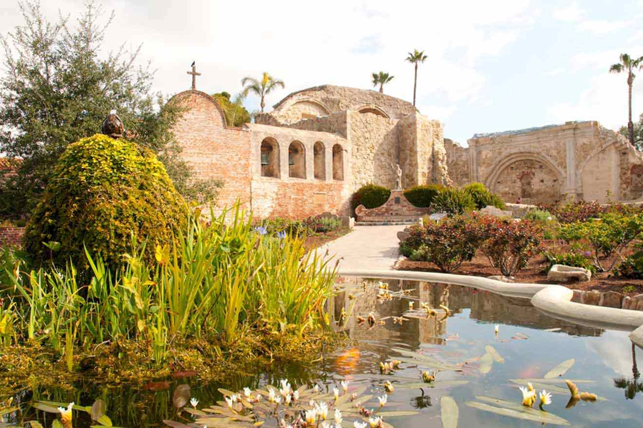 a pond in front of a building with a cross on it