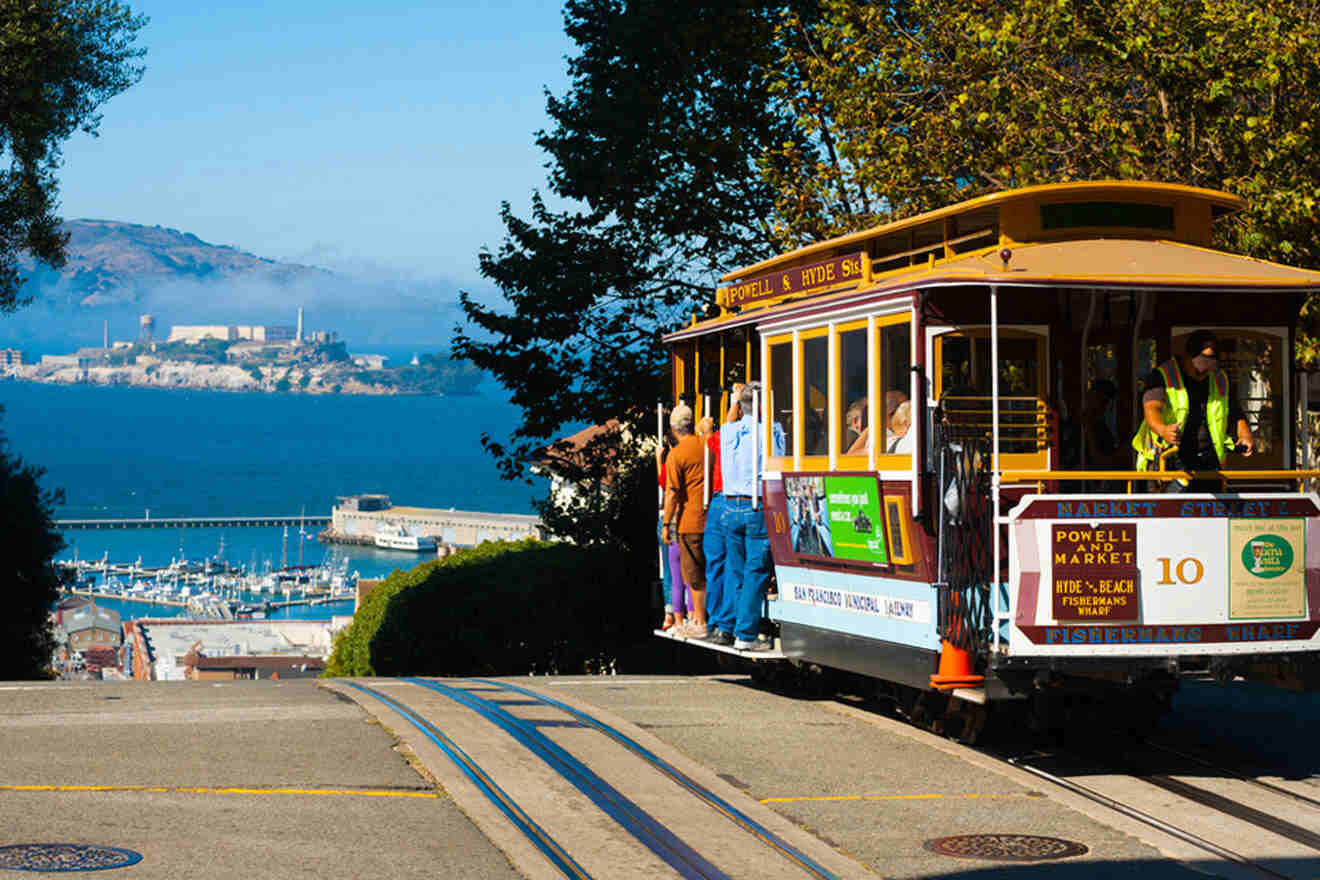 a cable car with people on it going down a hill