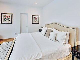 hotel's bedroom with bed, bedside table