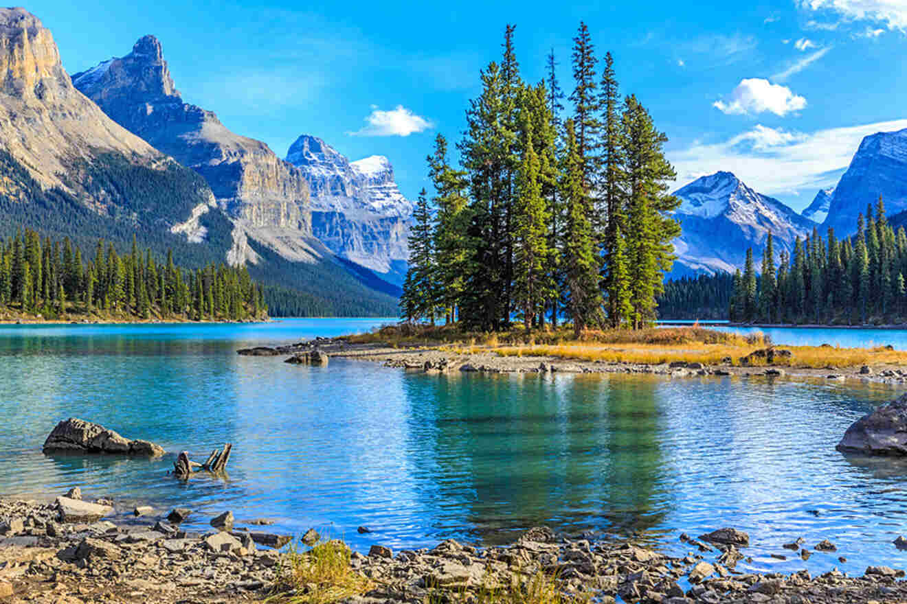 a lake surrounded by mountains and trees