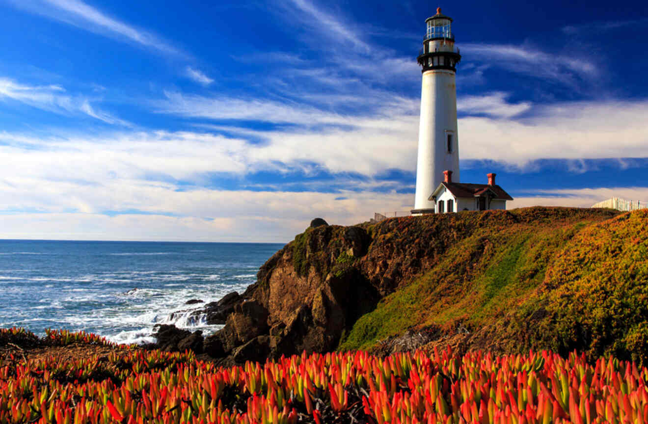 a lighthouse on top of a cliff near the ocean