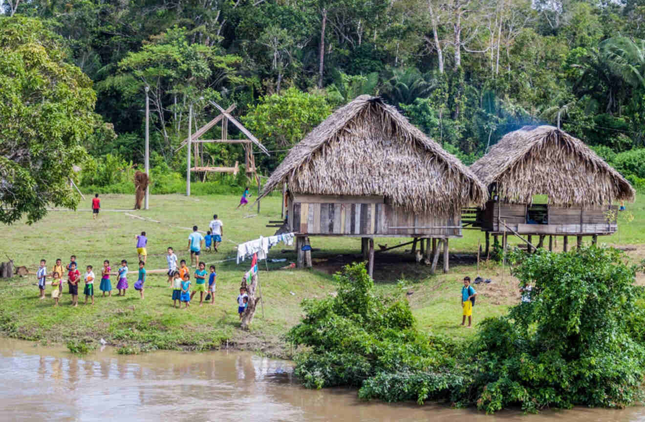 View of children and wooden houses in a village