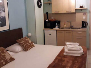 bedroom and kitchenette