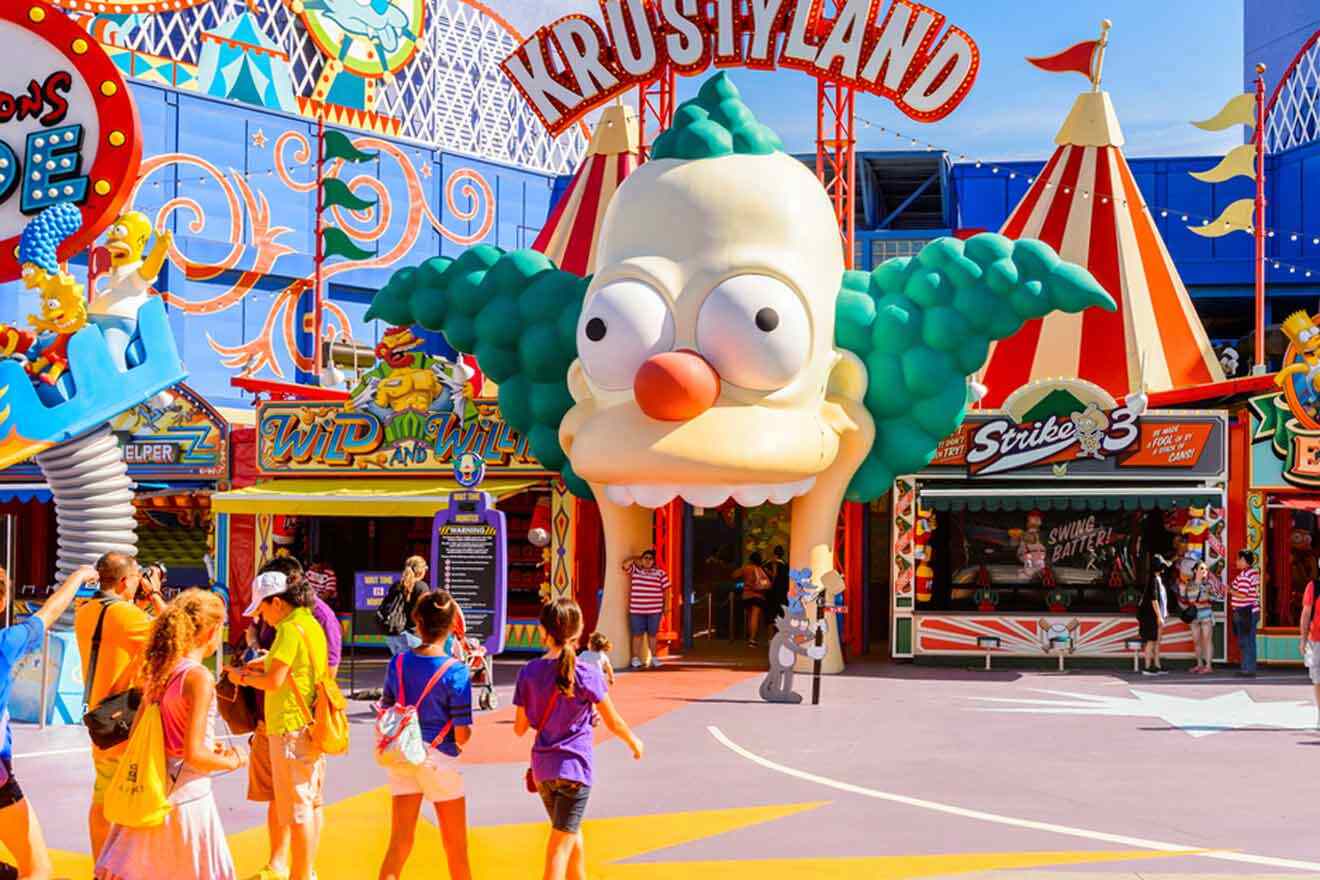 a group of people walking in front of a large head of Krusty Clown