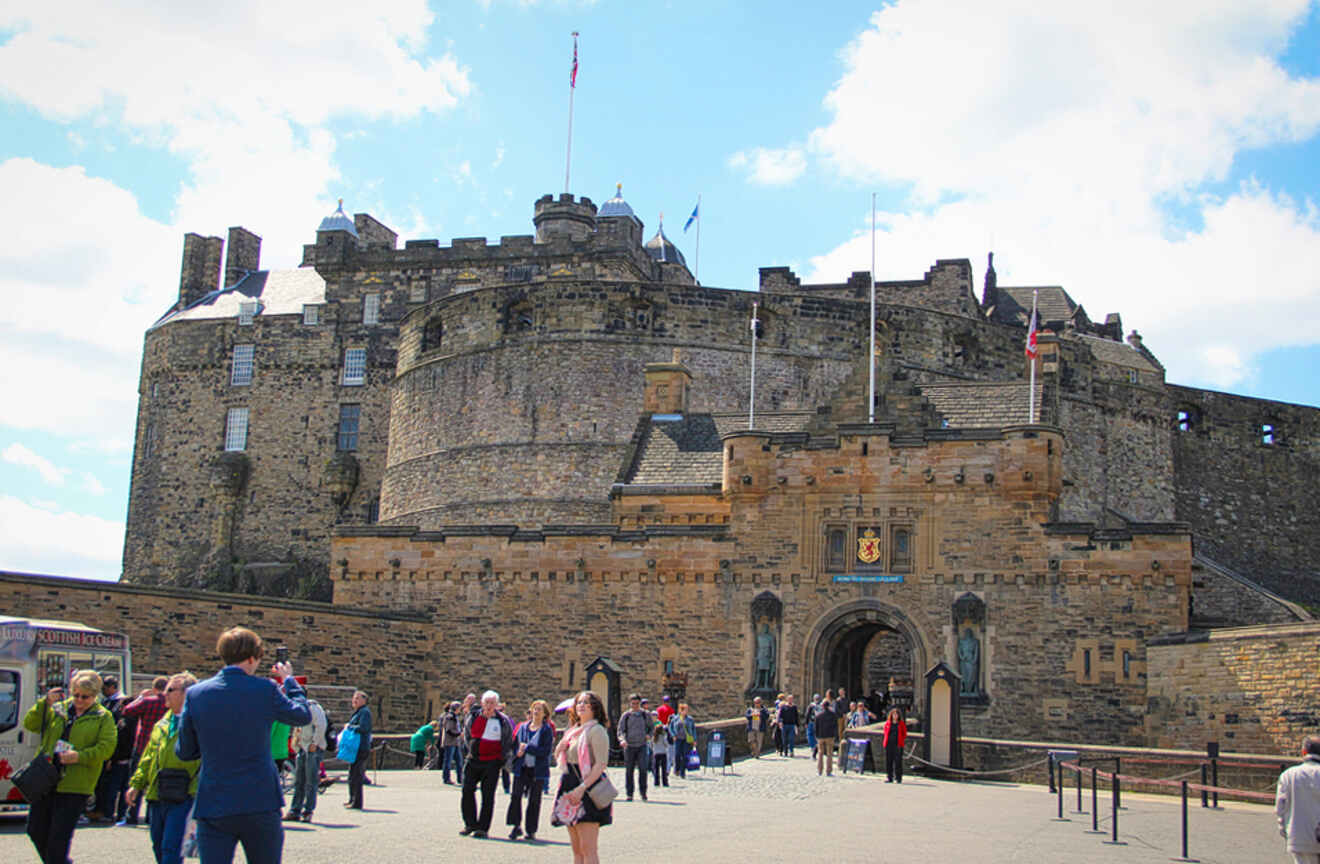 a group of people standing in front of a castle