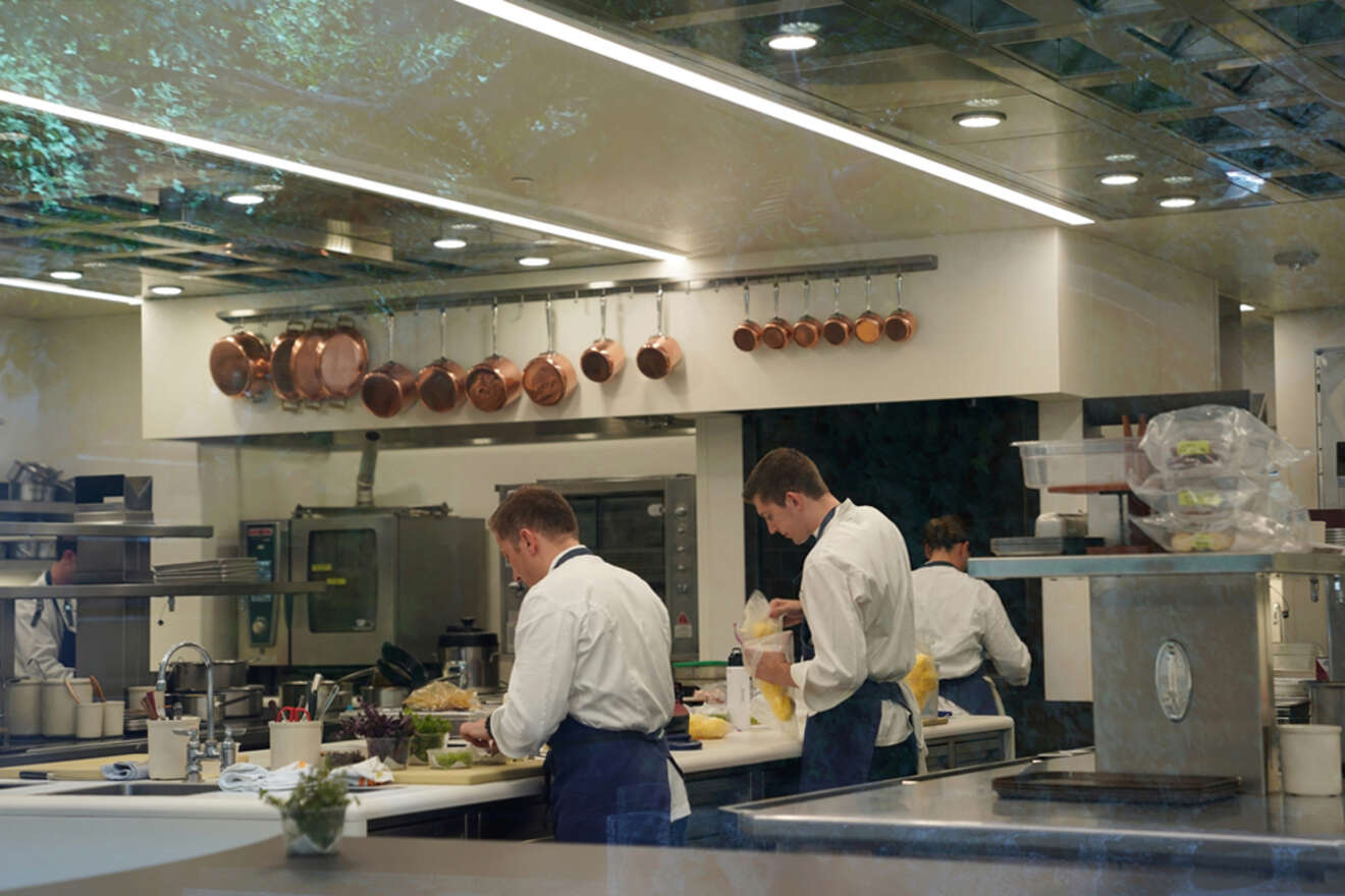 chefs in the kitchen preparing food