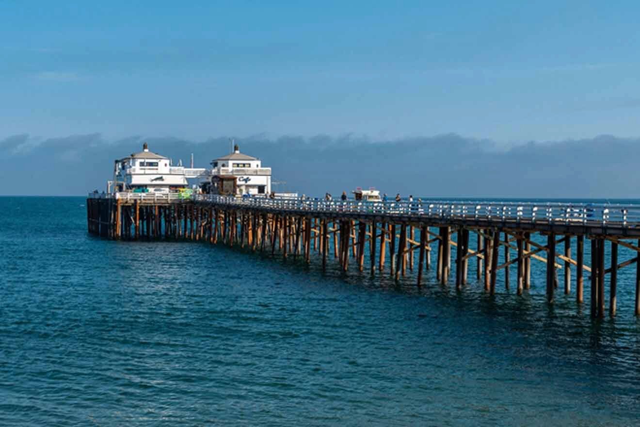 pier with cafes and shops surrounded by the ocean