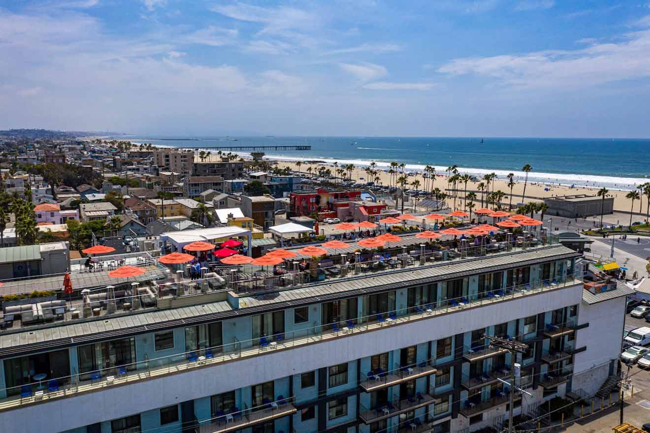 an aerial view of rooftop restaurant with a beach in the background