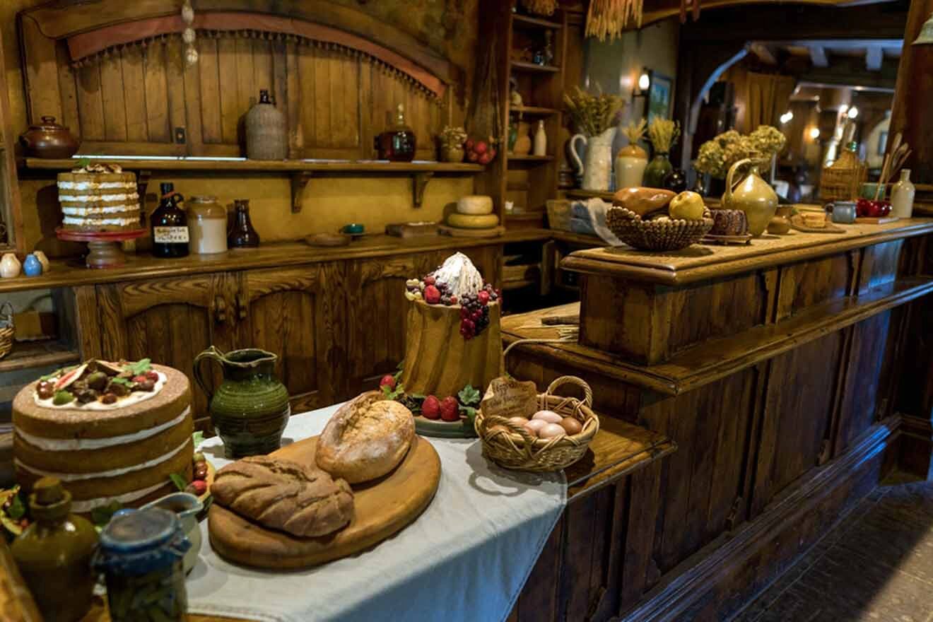 a table topped with lots of bread and pastries