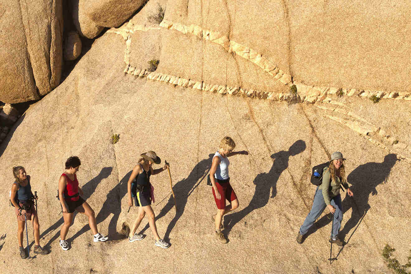 a group of people going on a rock trail