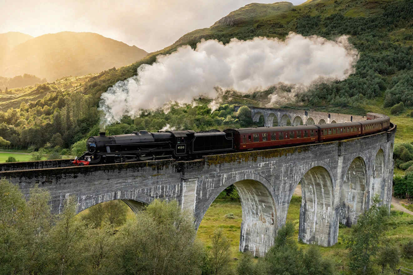 a train traveling over a bridge in the mountains