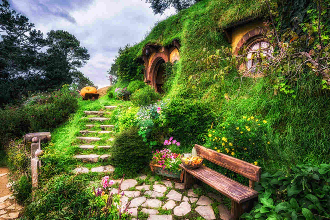 a green house with steps leading up to it