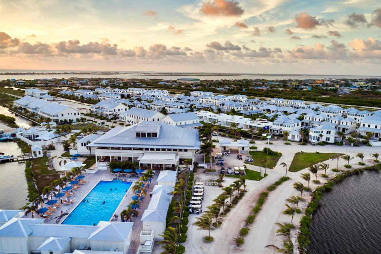 an aerial view of a resort with a swimming pool