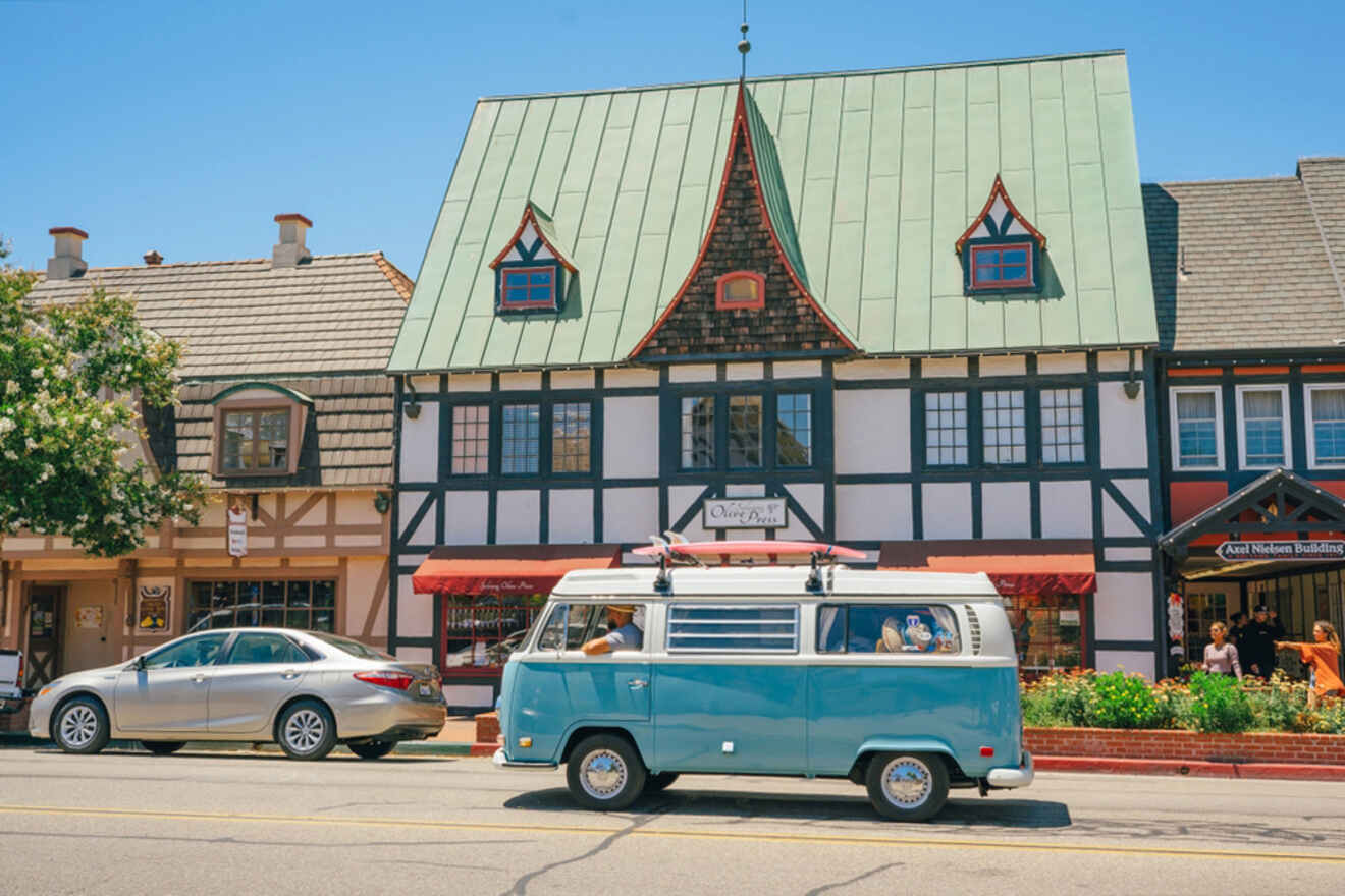 a road with cool buildings and cars on the street